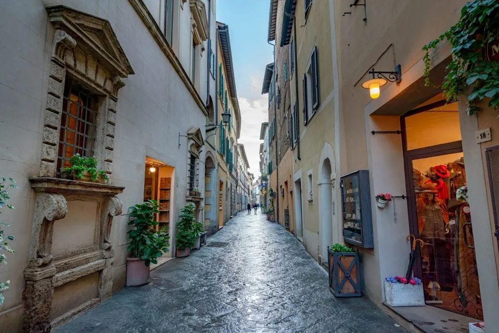 shopping street in montepulciano at dusk