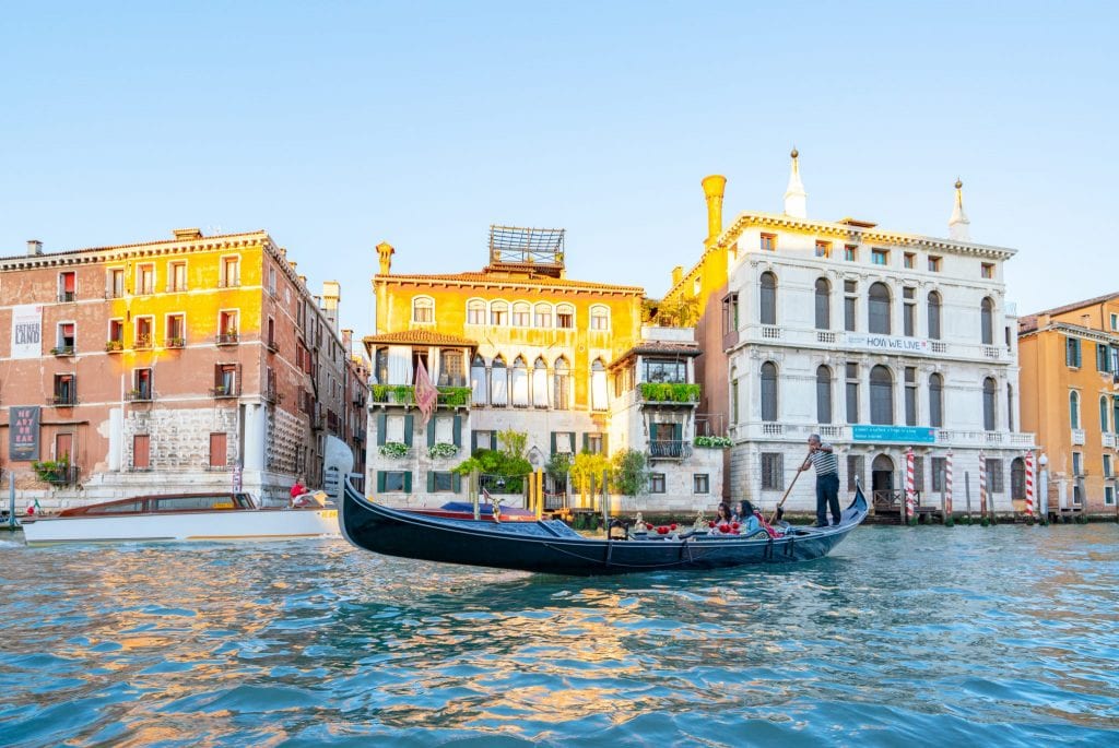 Gondola ride in Venice on the Grand Canal near sunset