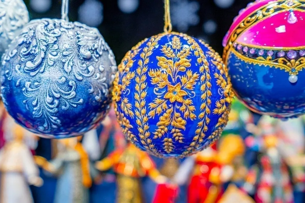 Beautiful handpainted blue and gold christmas ornament for sale at a french christmas market
