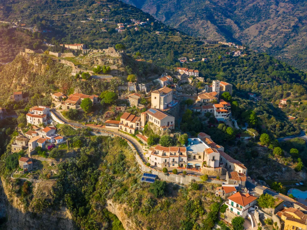 aerial view of savoca sicily surrounded by green hills