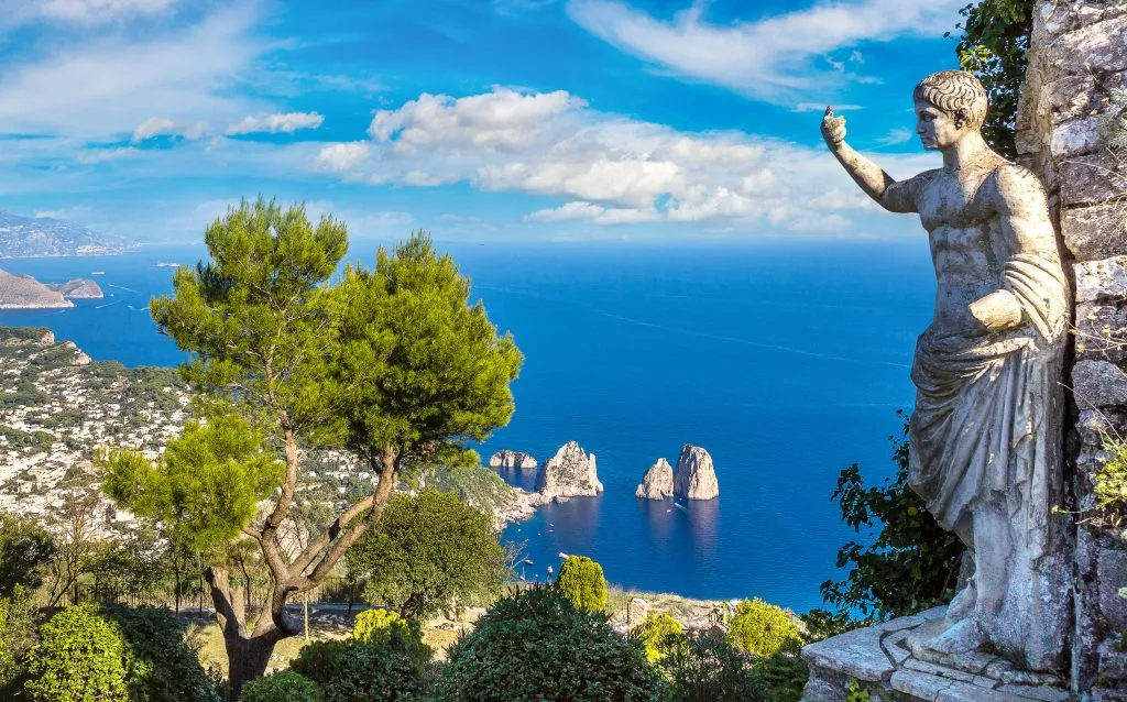 view of capri italy from above with a marble statue in the right foreground