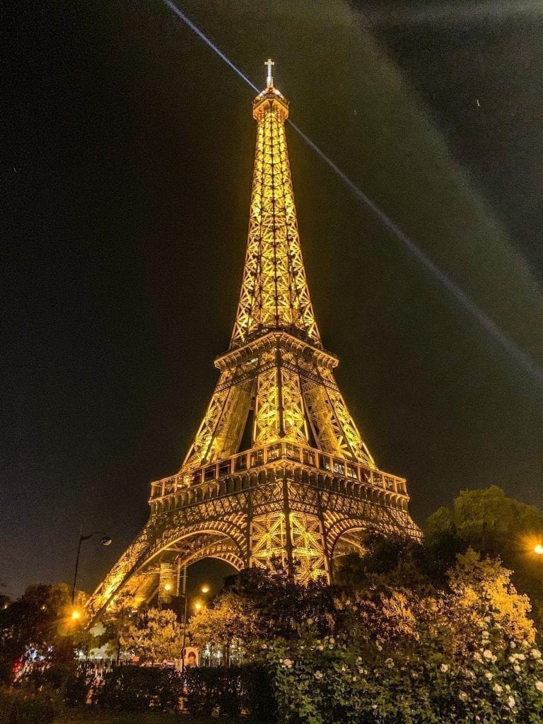 Eiffel Tower in Paris at night shot from below