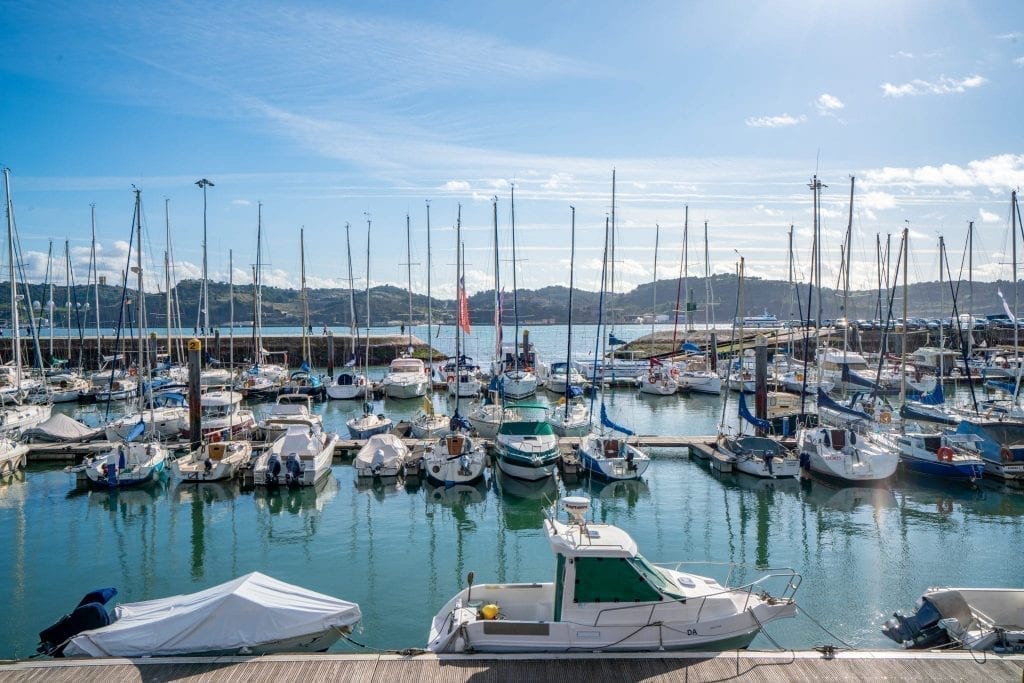 boats in the tagus river harbor on a sunny day in lisbon portugal