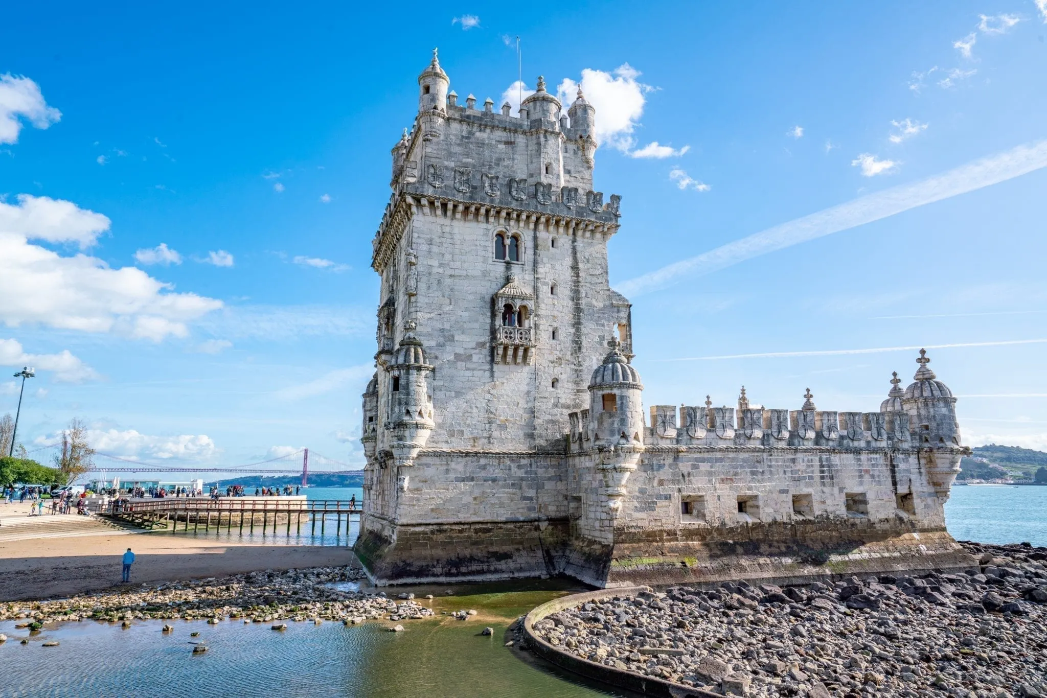 belem tower as viewed from the side on a sunny day, one of the best things to do in belem lisbon portugal