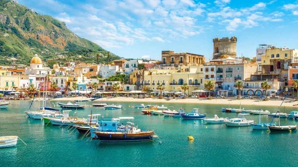 Village of Forio on Ischia Island as seen from the water, one of the best day trips from Sorrento Italy
