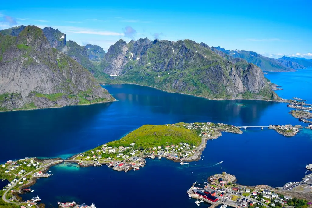 view of Reinebringen trail in lofoten islands norway, one of the best places to plan a road trip europe