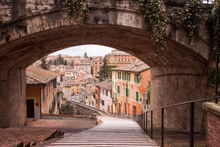 13th century arch framing a stairway leading into perugia italy aqueduct