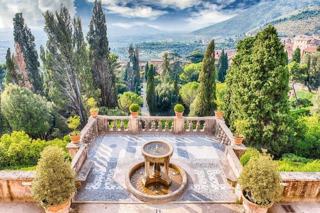 Gardens of Tivoli as seen from above, with a balcony in the foreground. Tivoli is one of the best day trips from Rome Italy