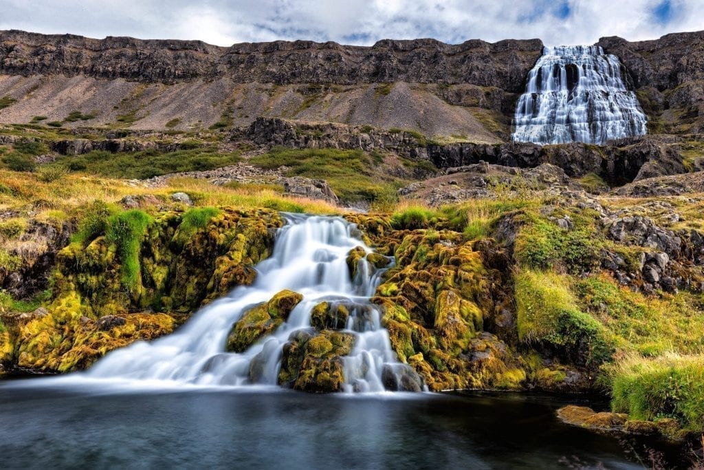 Dynjandi waterfall in the westfjords of Iceland, one of the best offbeat road trips in Europe