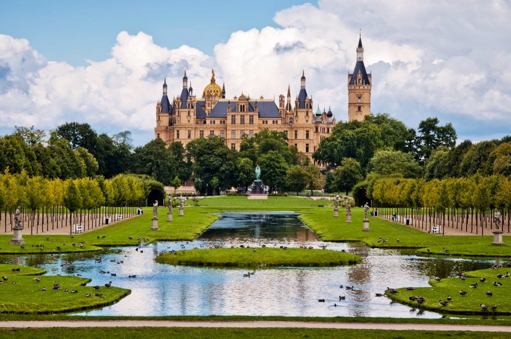 schwerin castle in germany with lake in the foreground, modeled after french chateaux