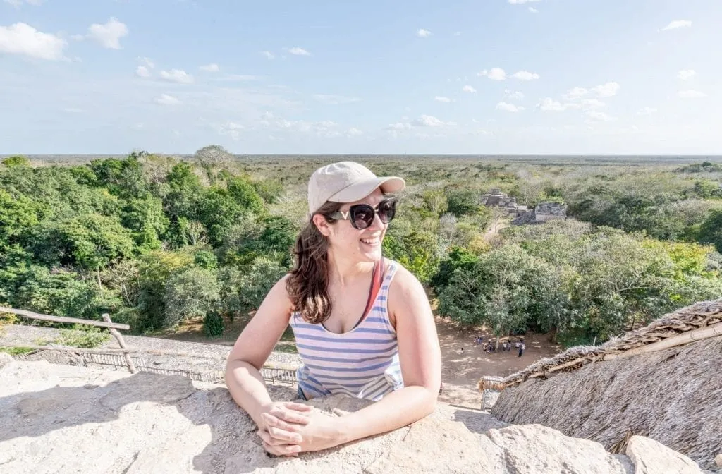 kate storm climbing the main pyramid of ek balam, one of the best things to see near valladolid mexico