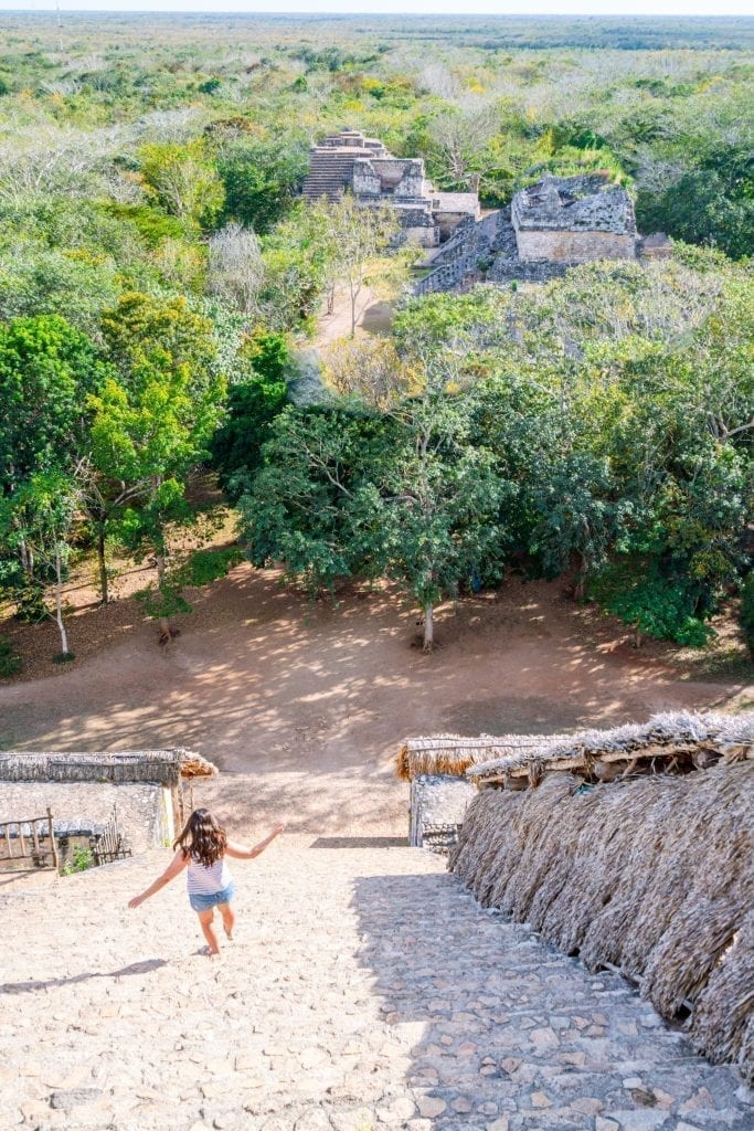 Kate Storm climbing down El Torre in Ek Balam Mexico with the staircase of the pyramid taking up most of the shot