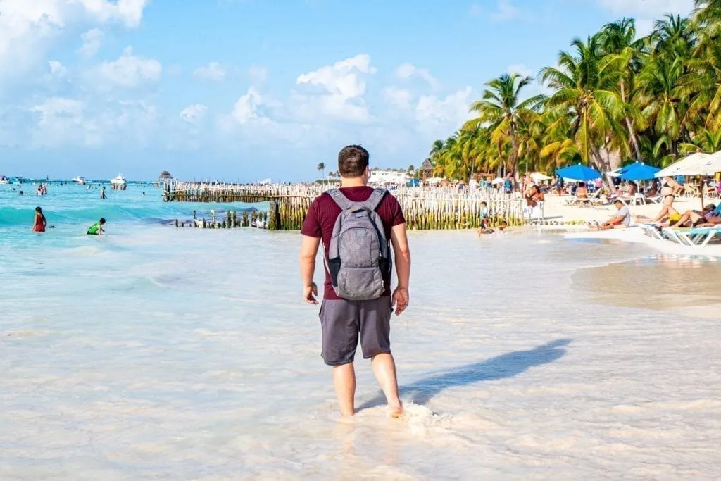 Jeremy Storm wearing Pacsafe antitheft backpack on Isla Mujeres Mexico