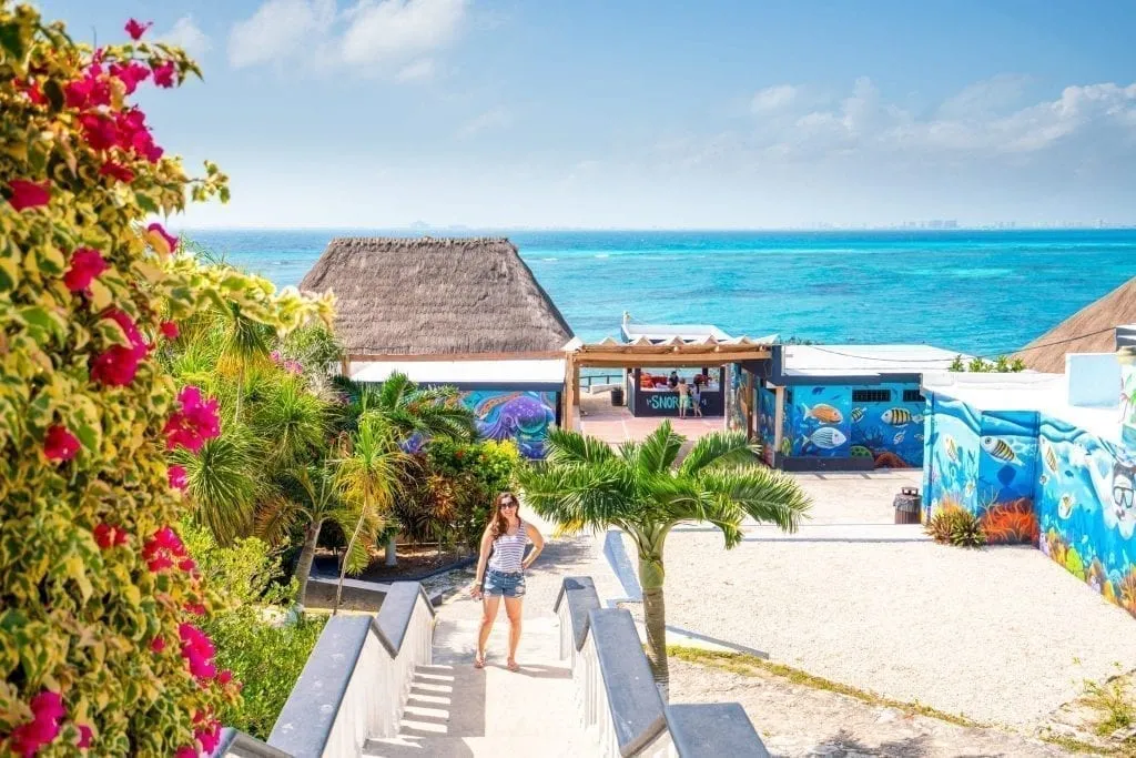kate storm at the entrance to an isla mujeres beach club