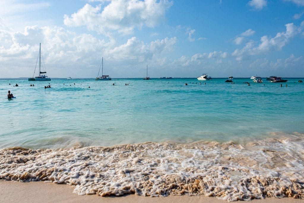 Playa Norte with sailboats in the distance, one of the best places to visit in Isla Mujeres Mexico
