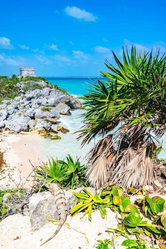 famous tulum ruins with beach in the foreground, one of the best mexico ruins to visit