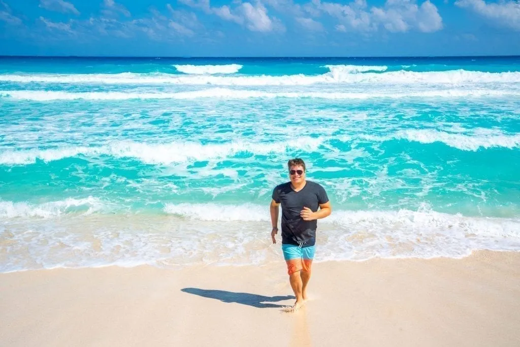 Jeremy Storm on Playa Delfines in Cancun on a sunny day during a road trip Yucatan