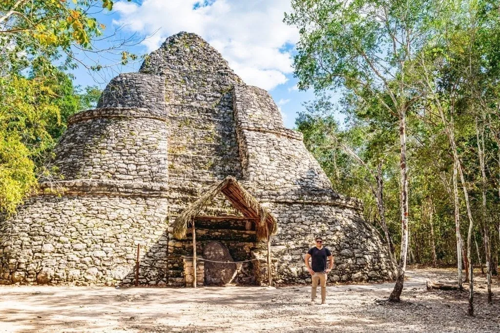 Jeremy Storm standing in front of a structure at the Coba ruins as seen on a backpacking Yucatan road trip