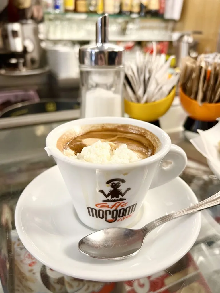 cafe con panna on the counter of an italian coffee bar in rome italy
