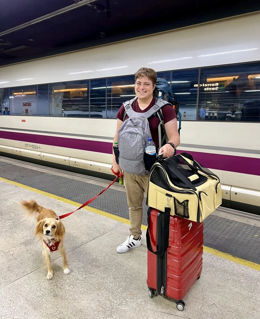 jeremy storm and ranger storm with luggage in front when traveling around europe by train