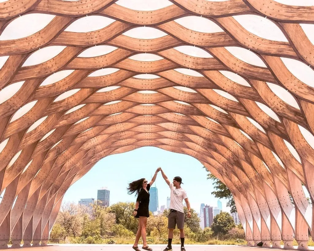 Zach and Julie Ruhl of Ruhls of the Road dancing in a Chicago Park. They are the authors of this 3 days in Chicago itinerary