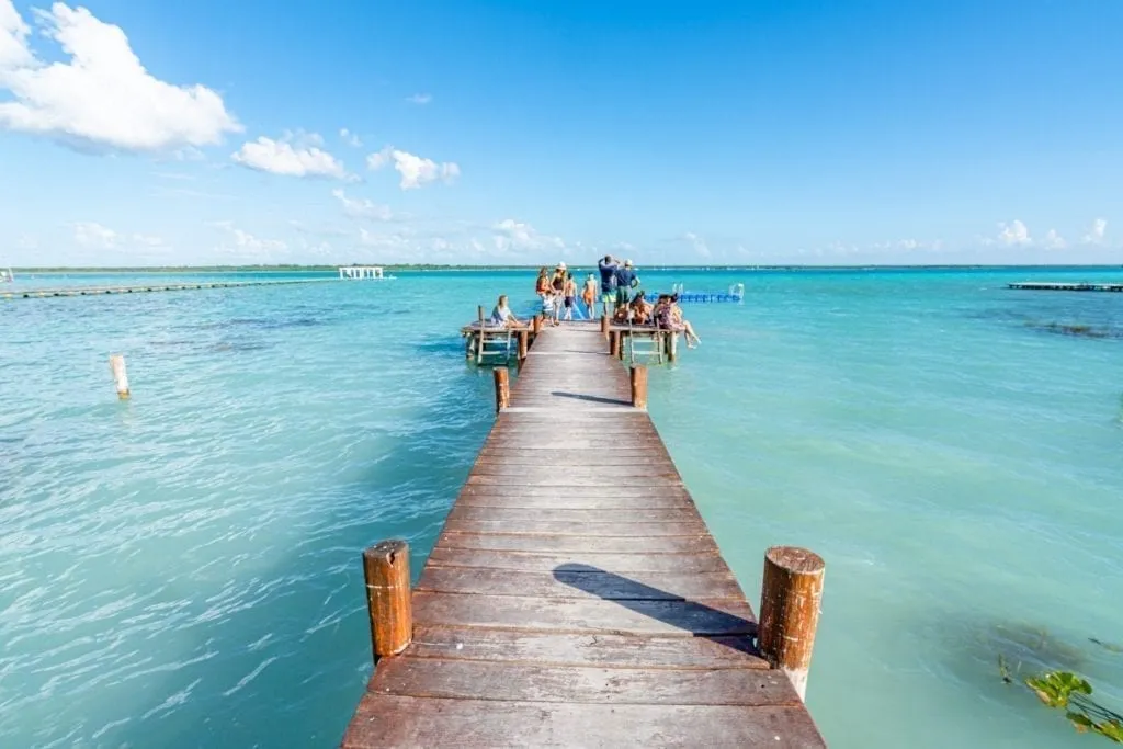 Dock at Bacalar Lagoon leading into the water, as seen on a road trip Yucatan travel itinerary