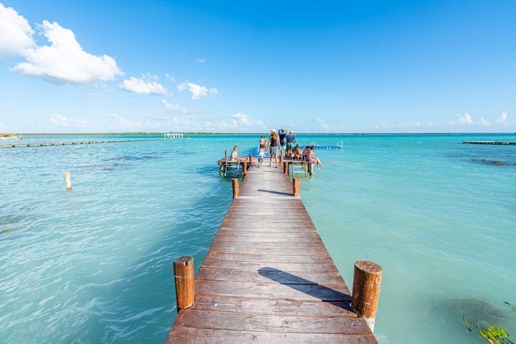 dock at bacalar lagoon leading into the water, a fantastic place to visit when backpacking mexico