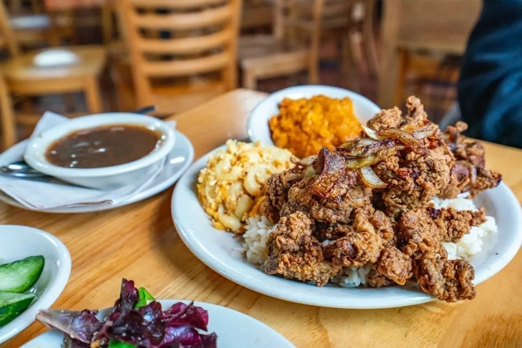 Plate of fried chicken livers in the south with a bowl of gravy to the left
