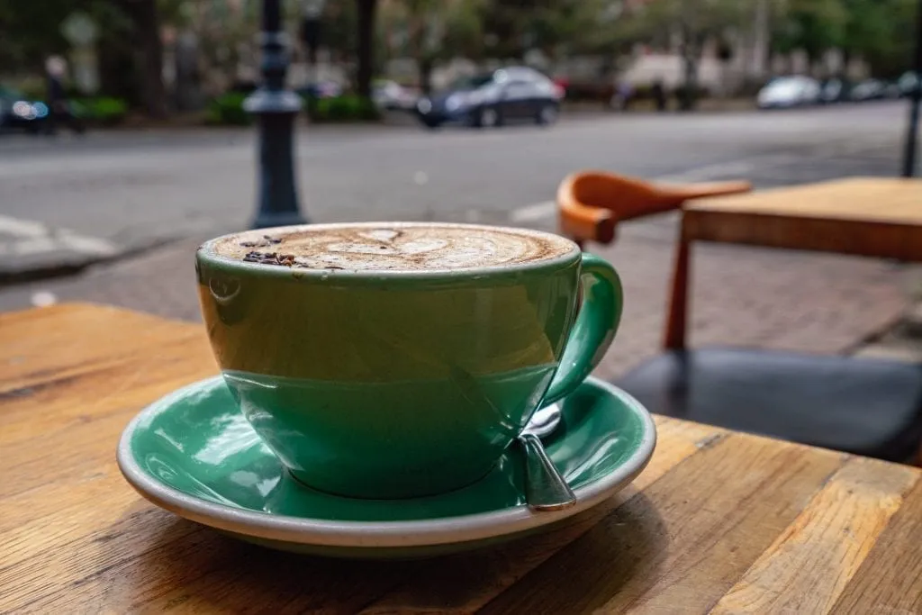 Spiced lavender mocha in a teal mug as served at the Collins Quarter, one of the best places to eat in Savannah in 3 days!