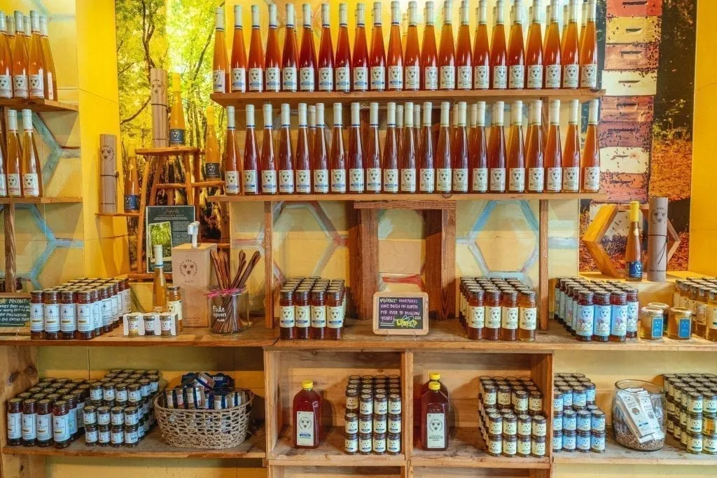 Interior of Savannah Bee Company showing multiple shelves of honey for sale