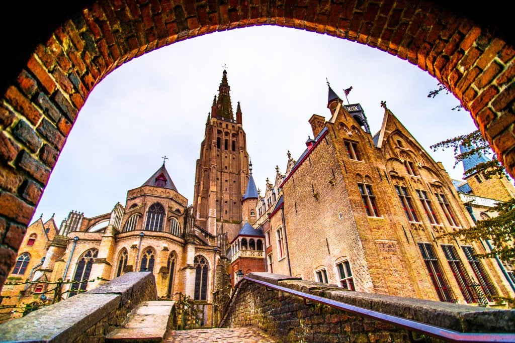 facade of the church of our lady bruges belgium as seen looking up from footbridge