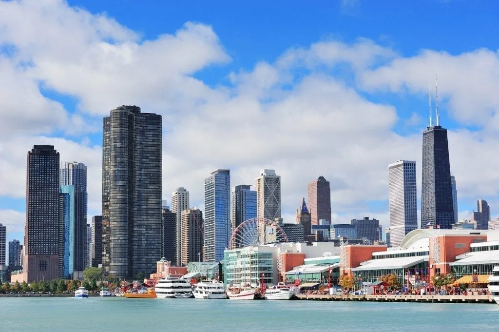 Chicago Navy Pier with skyscrapers visible in the background and Lake Michigan in the foreground