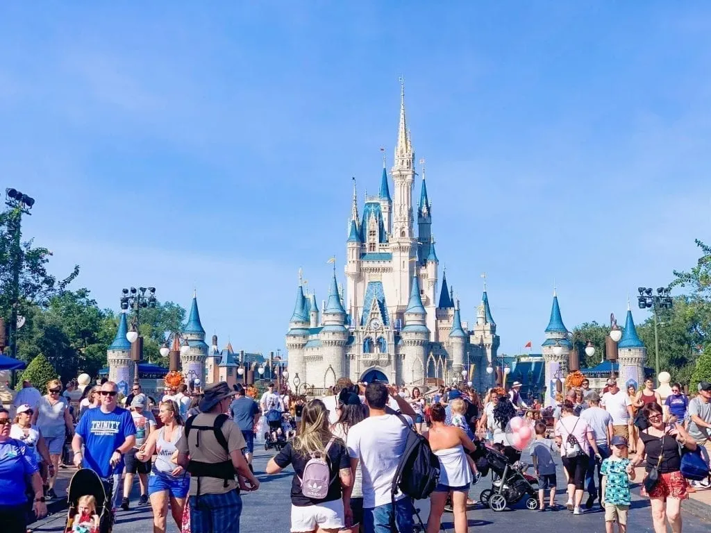 Magic Kingdom Castle in Florida with a crowd in front of it--Disney World is absolutely one of the top weekend getaways in the south