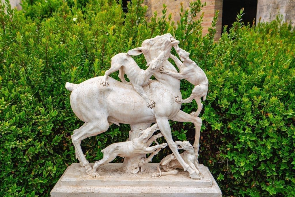Statue of a horse being attacked by dogs as seen in Herculaneum Italy