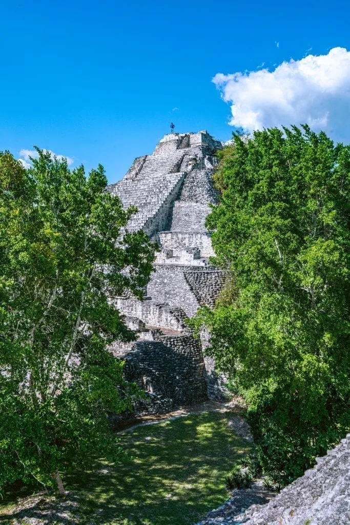 One of the tallest pyramids in Becan Mexico peeking up above the trees