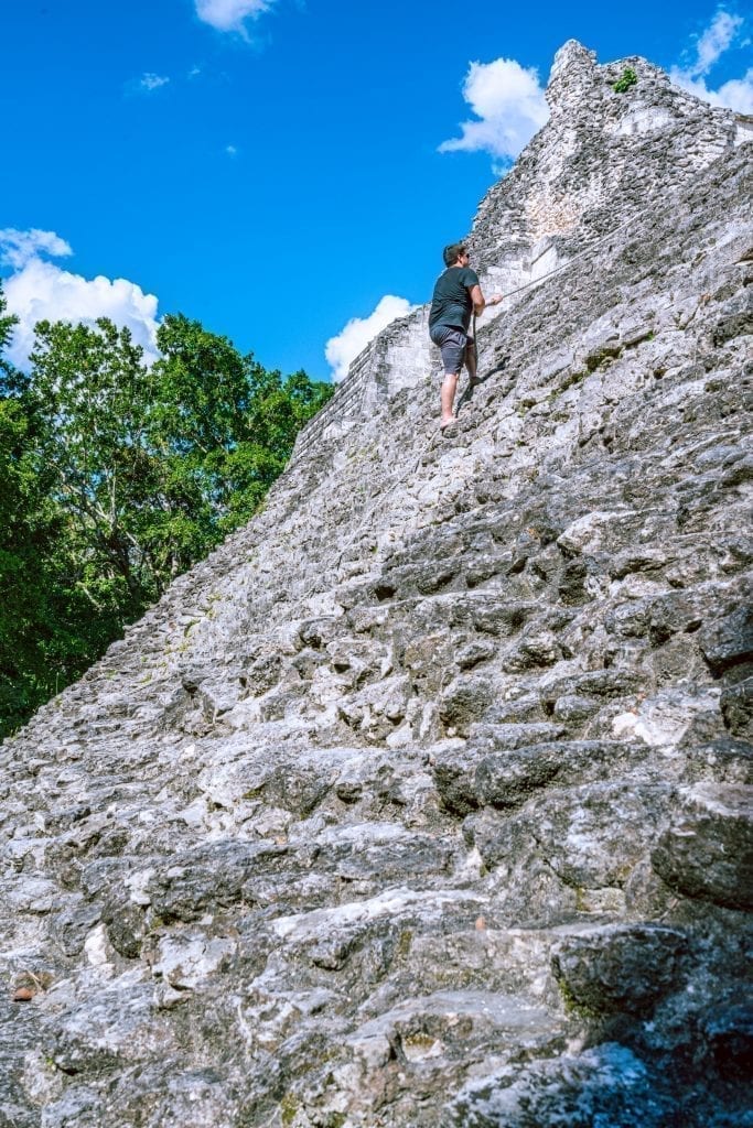 jeremy storm climbing a pyramid mexico ruins becan with help of a rope