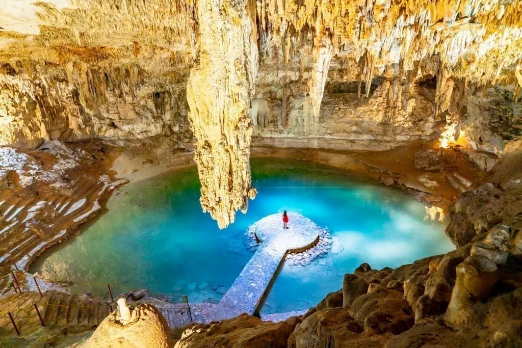 Kate Storm standing in the center of Cenote Suytun near Valladolid, an amazing addition to a 10 day Yucatan itinerary