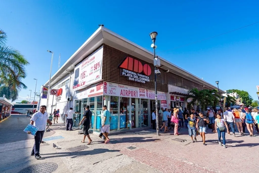 Exterior of ADO bus station on 5th Avenue Playa del Carmen--taking the ADO buses is one of our top tips for traveling to Mexico