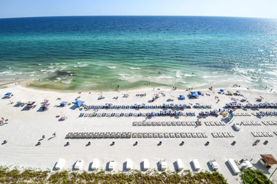 Panama City Beach in Florida as seen from above with beach chairs laid out. PCB is a classic weekend trip in the south