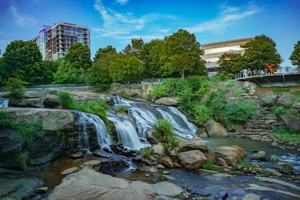 Downtown Greenville South Carolina, an up and coming southern weekend getaway, with the river in the foreground of the photo