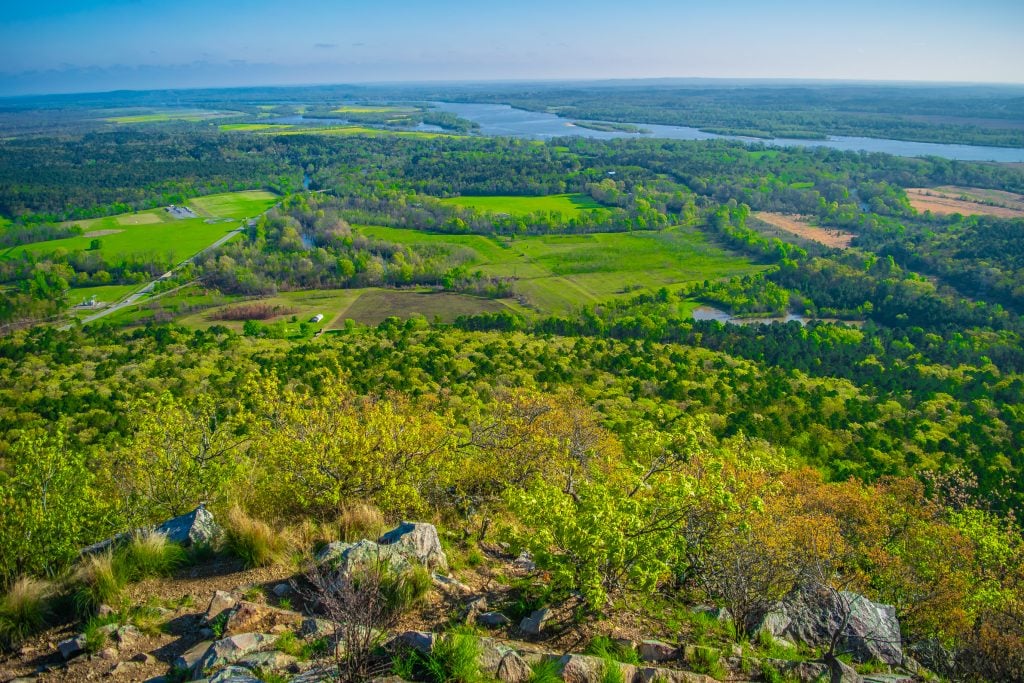 view of forest and river from pinnacle mountain in little rock ar, one of the best places to visit in southeast usa