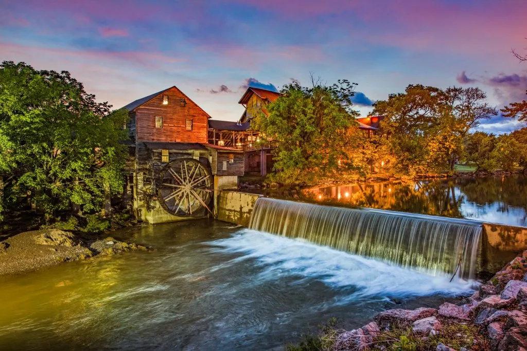 historic gristmill in pigeon forge tennessee at night, one of the best places to stay down south