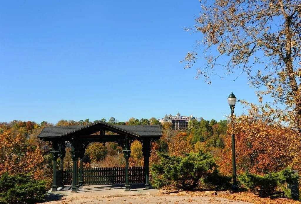 View of overlook near Eureka Springs Arkansas with Crescent Hotel visible in the distance, one of the best weekend getaways in the south usa