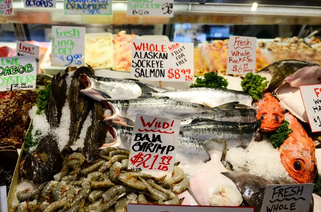 fresh seafood for sale at pikes place market, one of the best places to visit seattle weekend getaway