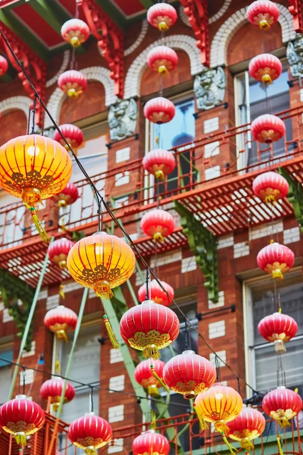 red and yellow chinese lanterns hanging in san francisco chinatown
