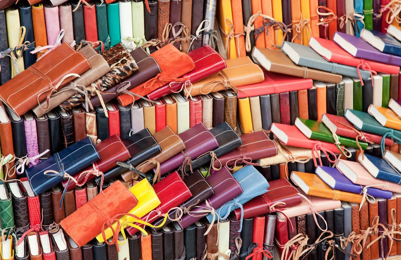collection of leather notebooks for sale when shopping in italy