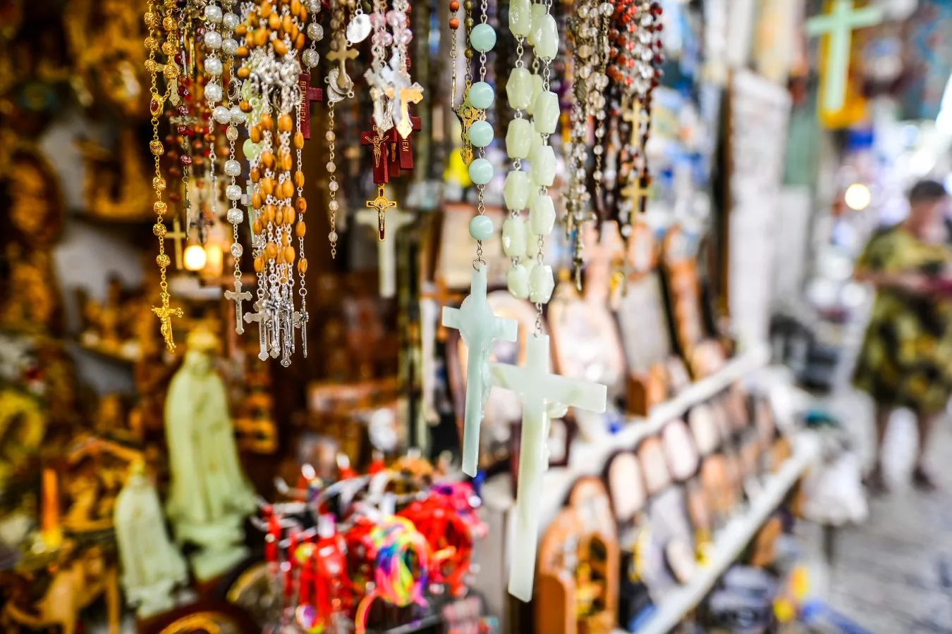 rosaries and icons for sale at a market in italy