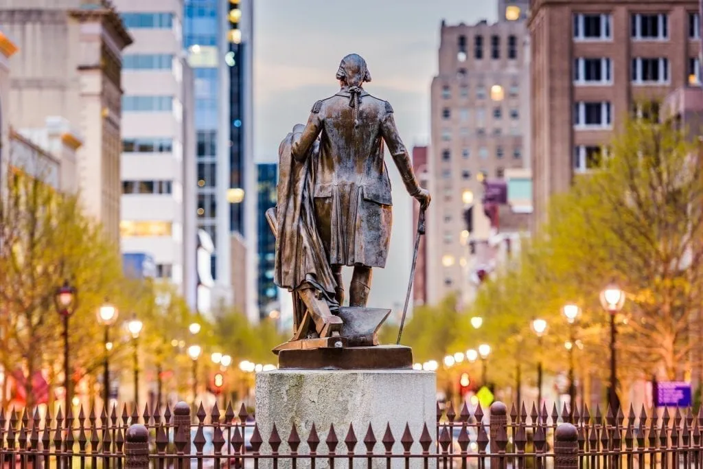 Statue of George Washington overlooking the city of Raleigh NC at sunset