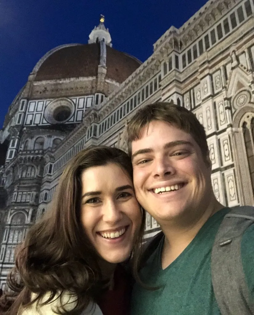 Kate Storm and Jeremy Storm taking a selfie with the Duomo in Florence at night