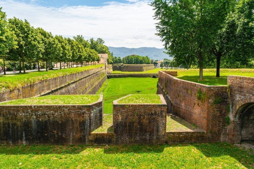 view of a park in lucca italy along the city walls